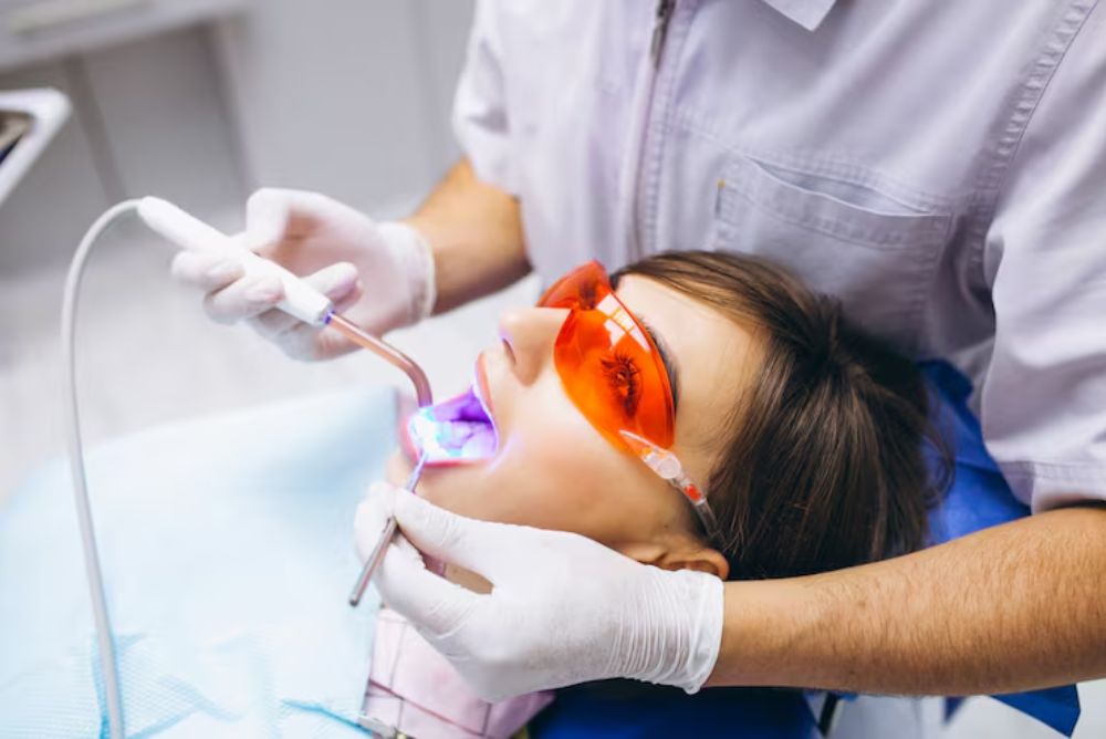 patient receiving professional teeth whitening treatment before a special event to achieve a brighter confident smile